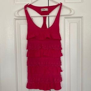 Pink sleeveless top.